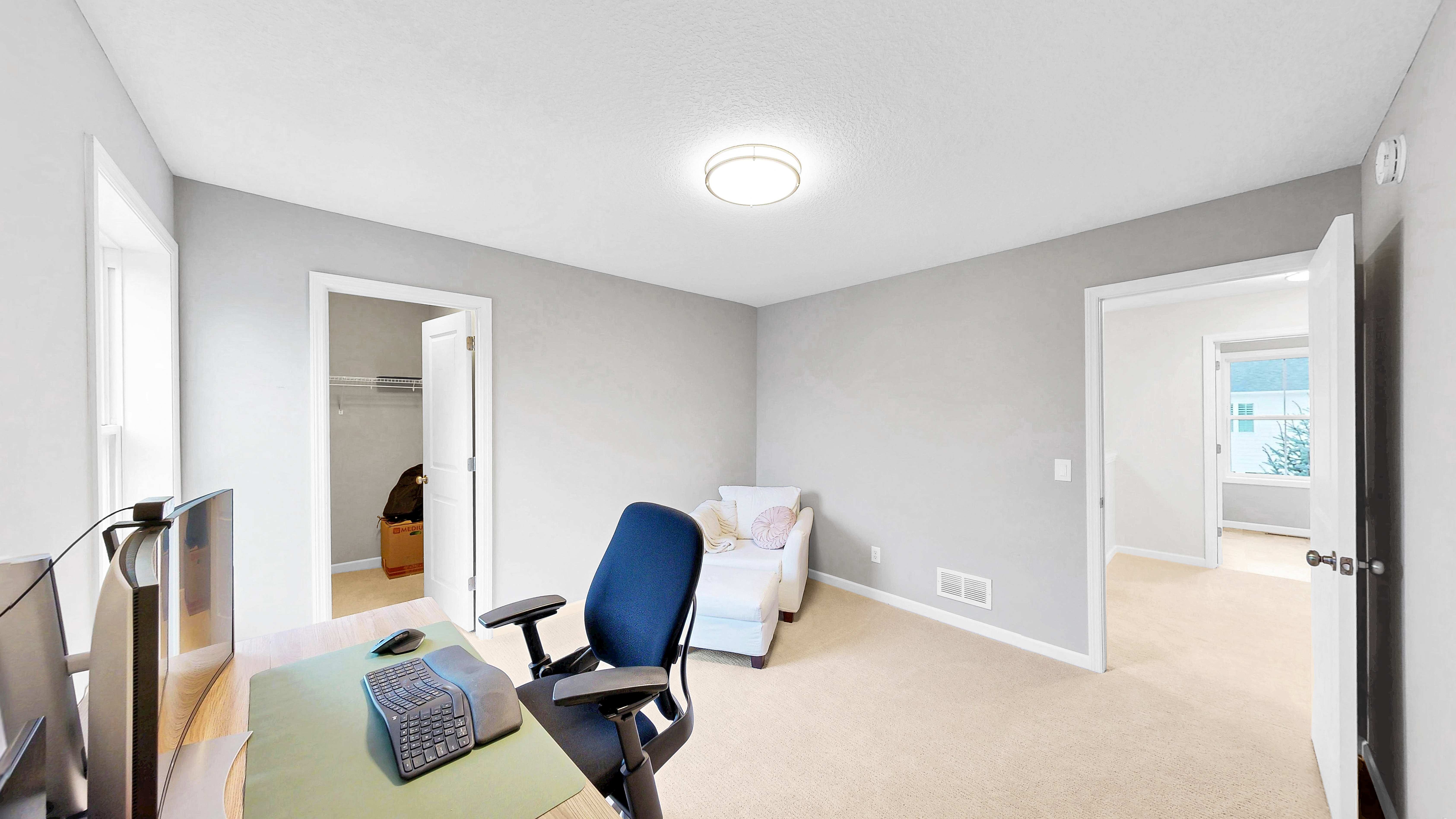 Bedroom used as office with walk-in closet