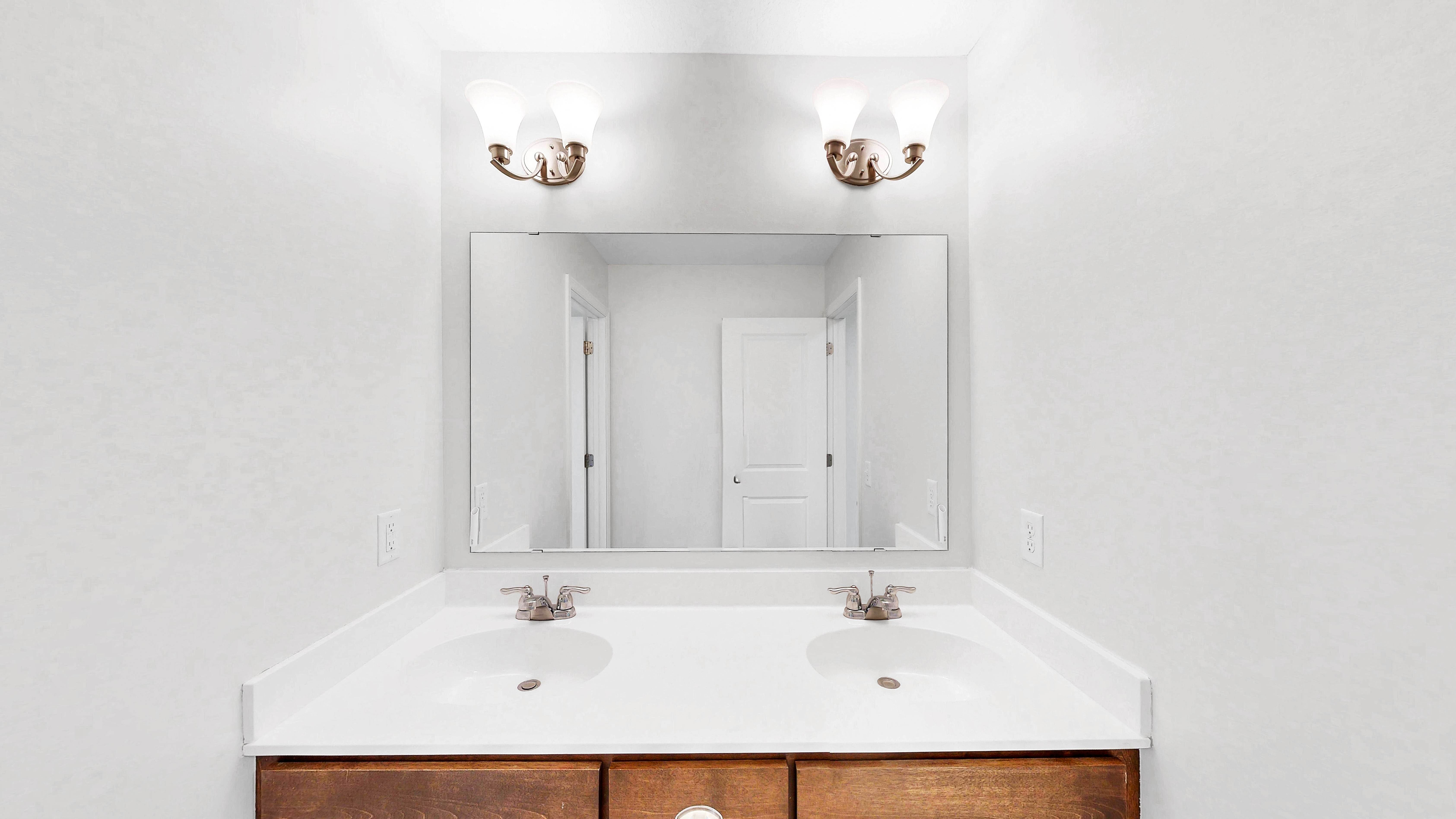 Upper level hall bath with double sink vanity