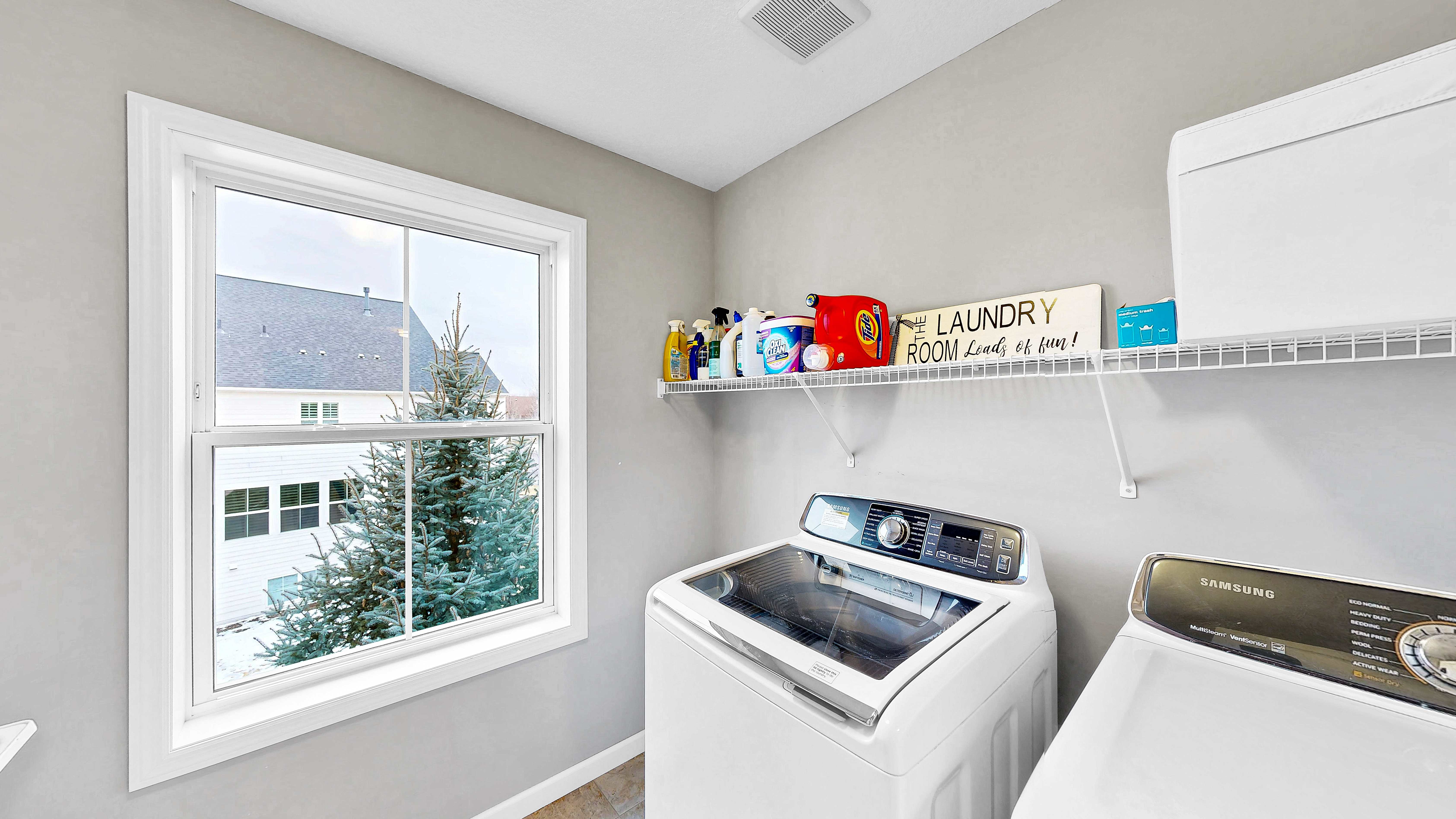 Upper level laundry room with Samsung washer and dryer